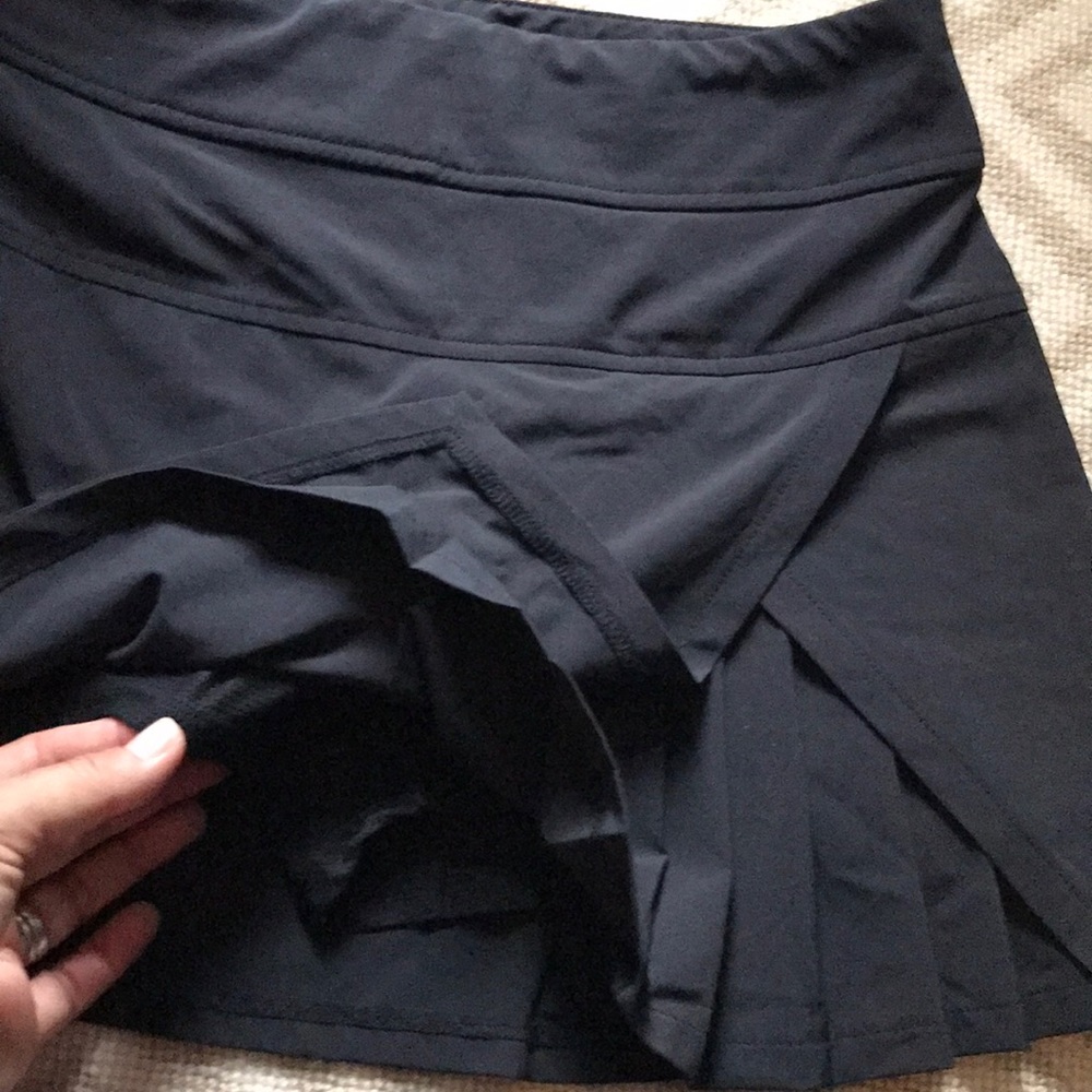 EUC Athleta black skort with pleats at front left